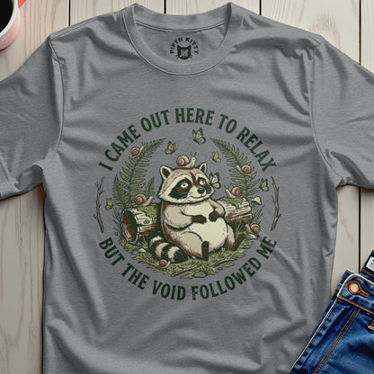 Raccoon sitting with snails and text "I came out here to relax but the void followed me."