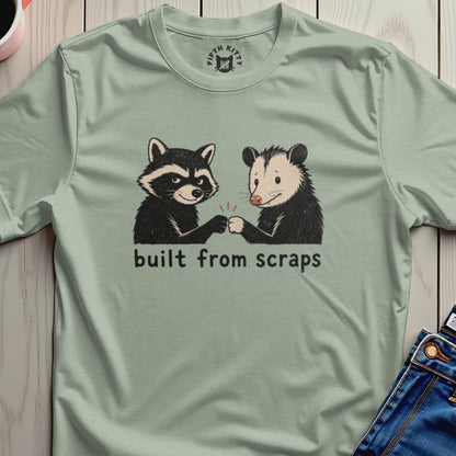 A raccoon and possum fist-bump under the text "built from scraps".