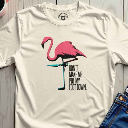 Cream t-shirt with a pink flamingo and "Don't make me put my foot down" text.