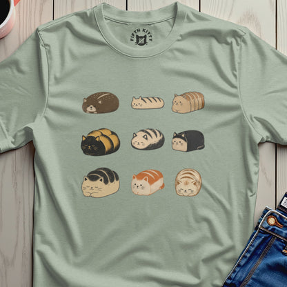 T-shirt with a repeating pattern of cartoon cats resembling loaves of bread.