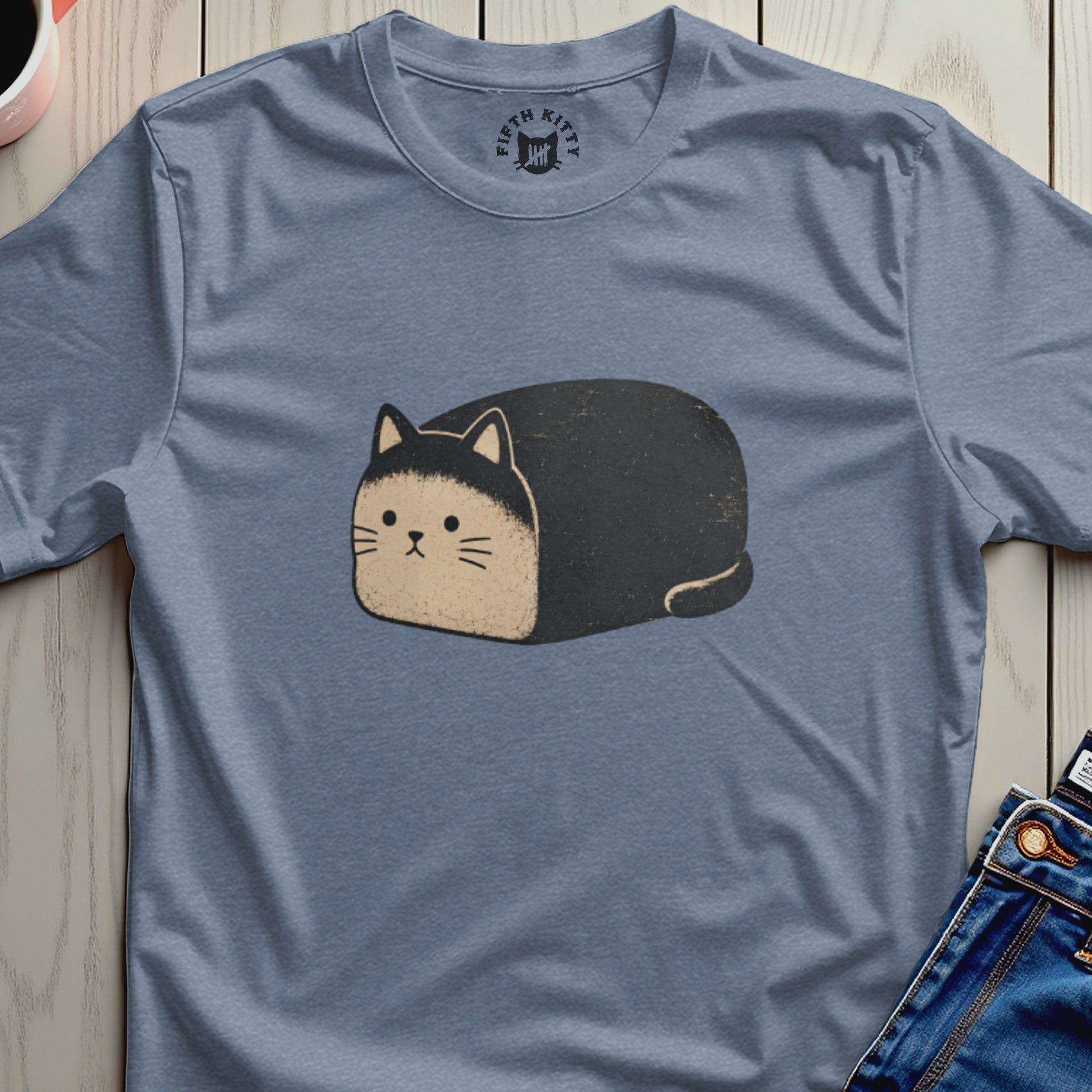 Blue t-shirt with a cartoon black and tan cat illustration and Fifth Kitty logo.