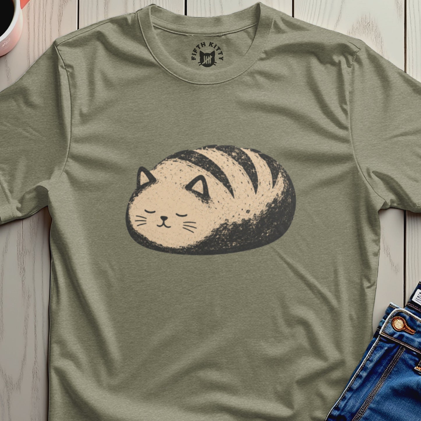 T-shirt graphic of a cat-shaped loaf of bread with stripes.