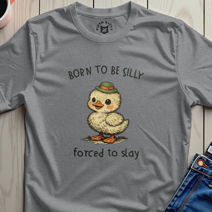 Gray t-shirt with a cartoon duckling in a hat and text "BORN TO BE SILLY FORCED TO SLAY".
