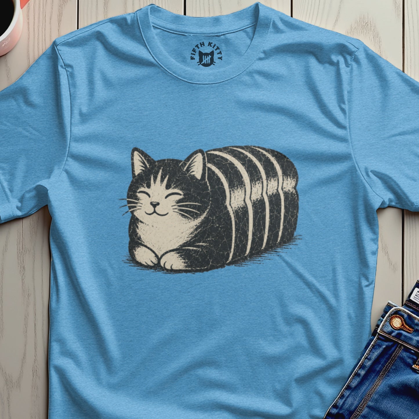 Light blue t-shirt featuring a black and white striped cat design and "FIFTH KITTY" neck logo.