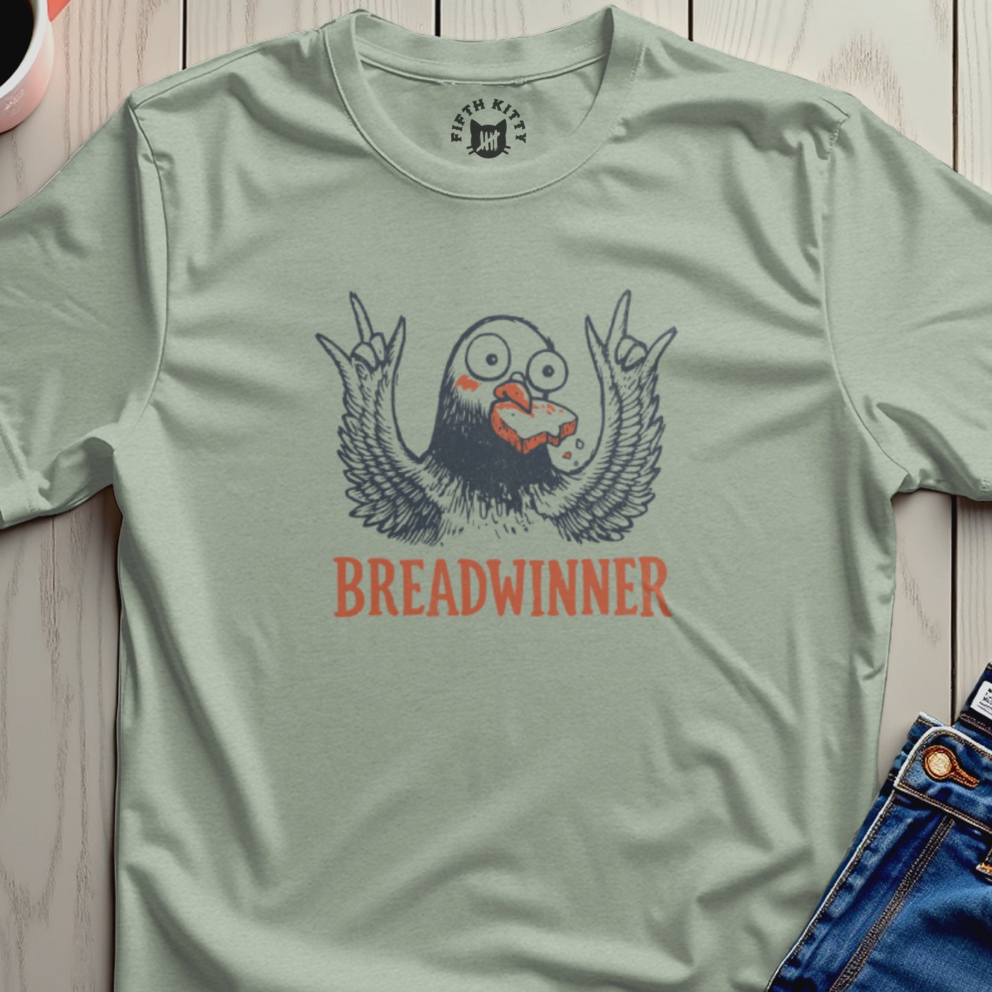 T-shirt with a cartoon bird holding bread, reads "Breadwinner".