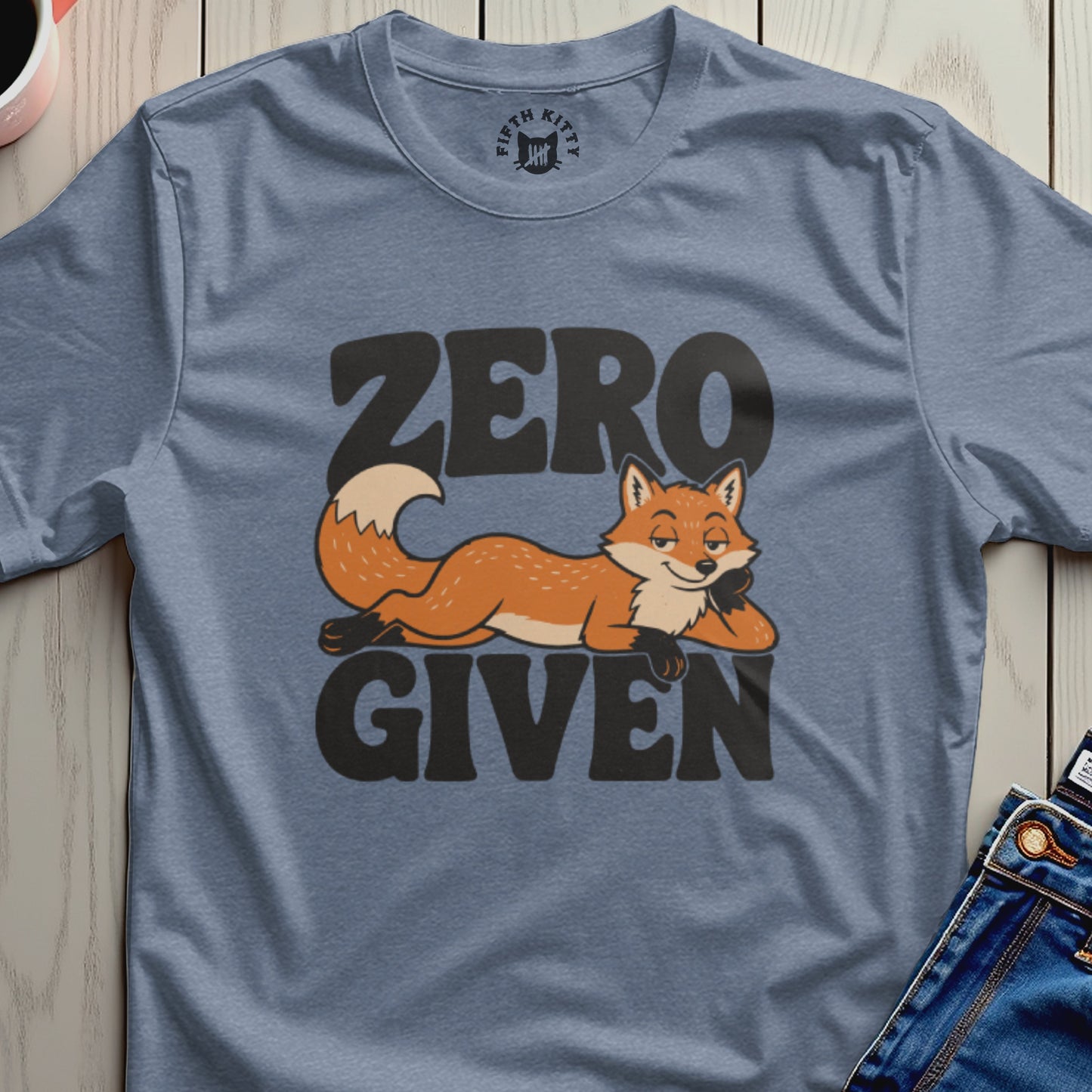 Blue t-shirt with "ZERO GIVEN" text and a reclining cartoon fox.