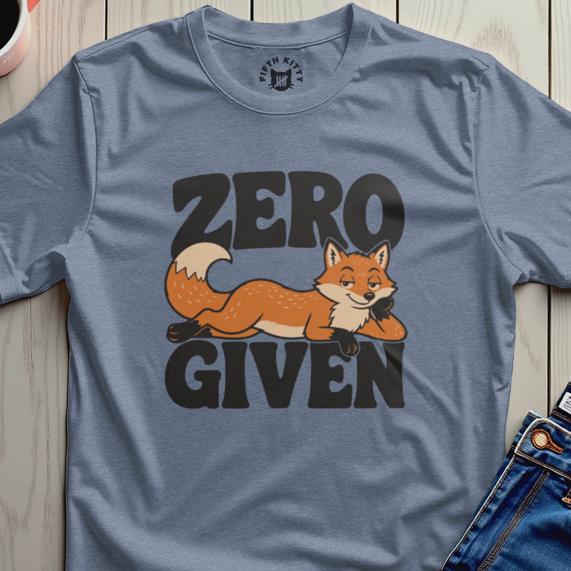 Blue t-shirt with "ZERO GIVEN" text and a reclining cartoon fox.