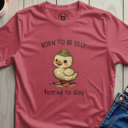 T-shirt with a duckling wearing a green hat and text "Born to be silly, forced to slay."