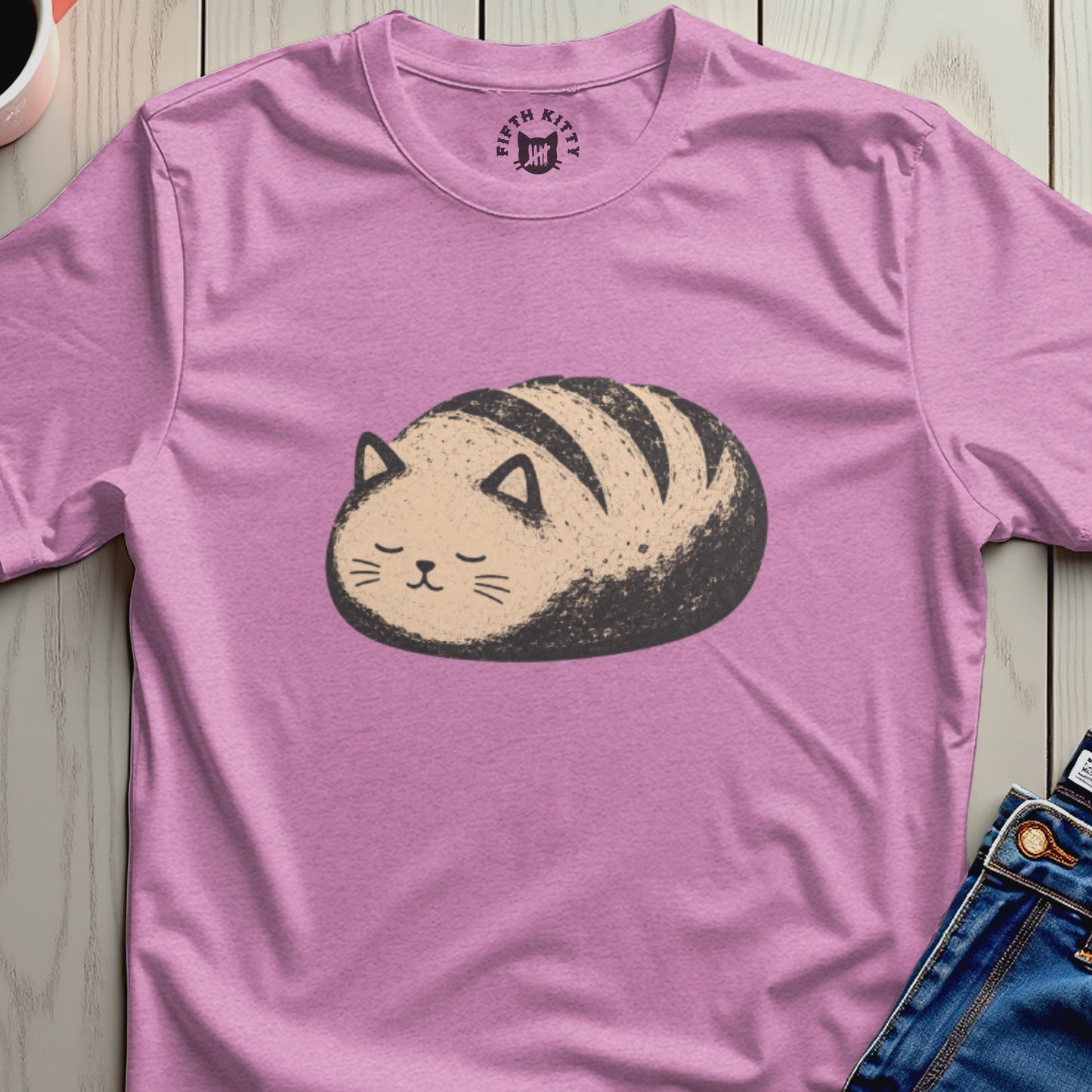 Pink t-shirt with a drawing of a bread loaf shaped cat.