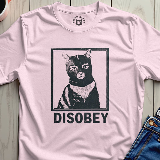 Black cat wearing a ski mask and "DISOBEY" text on a pink t-shirt.