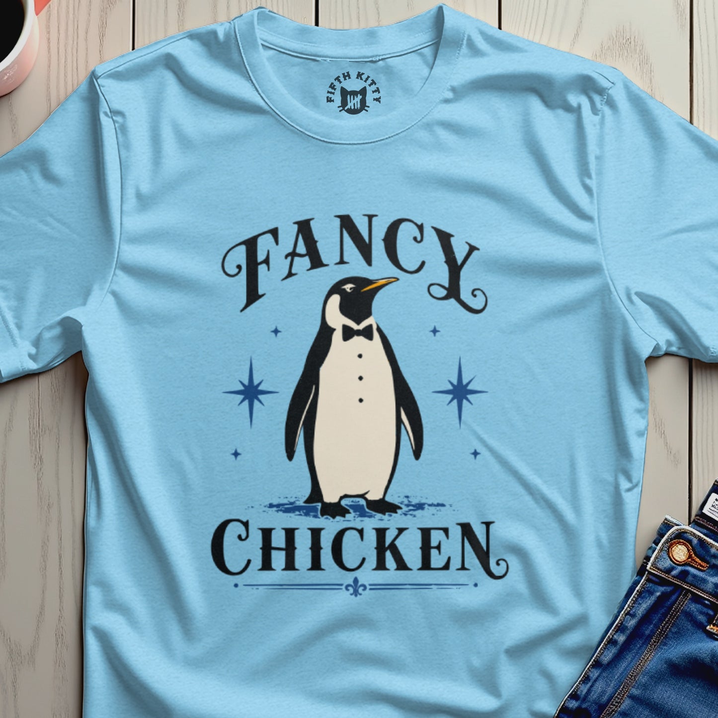 Light blue t-shirt with a penguin in a tuxedo and "Fancy Chicken" text.