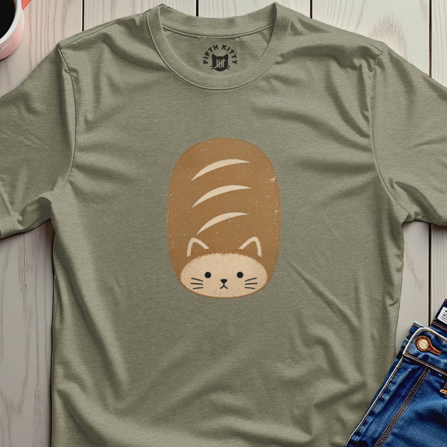 A t-shirt with a cute cat-shaped bread loaf graphic and "Fifth Kitty" logo.