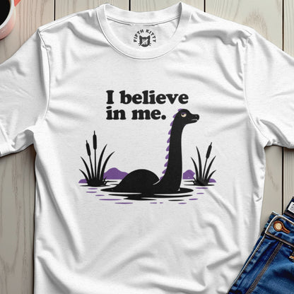 White t-shirt with a Nessie-like creature and the text "I believe in me."