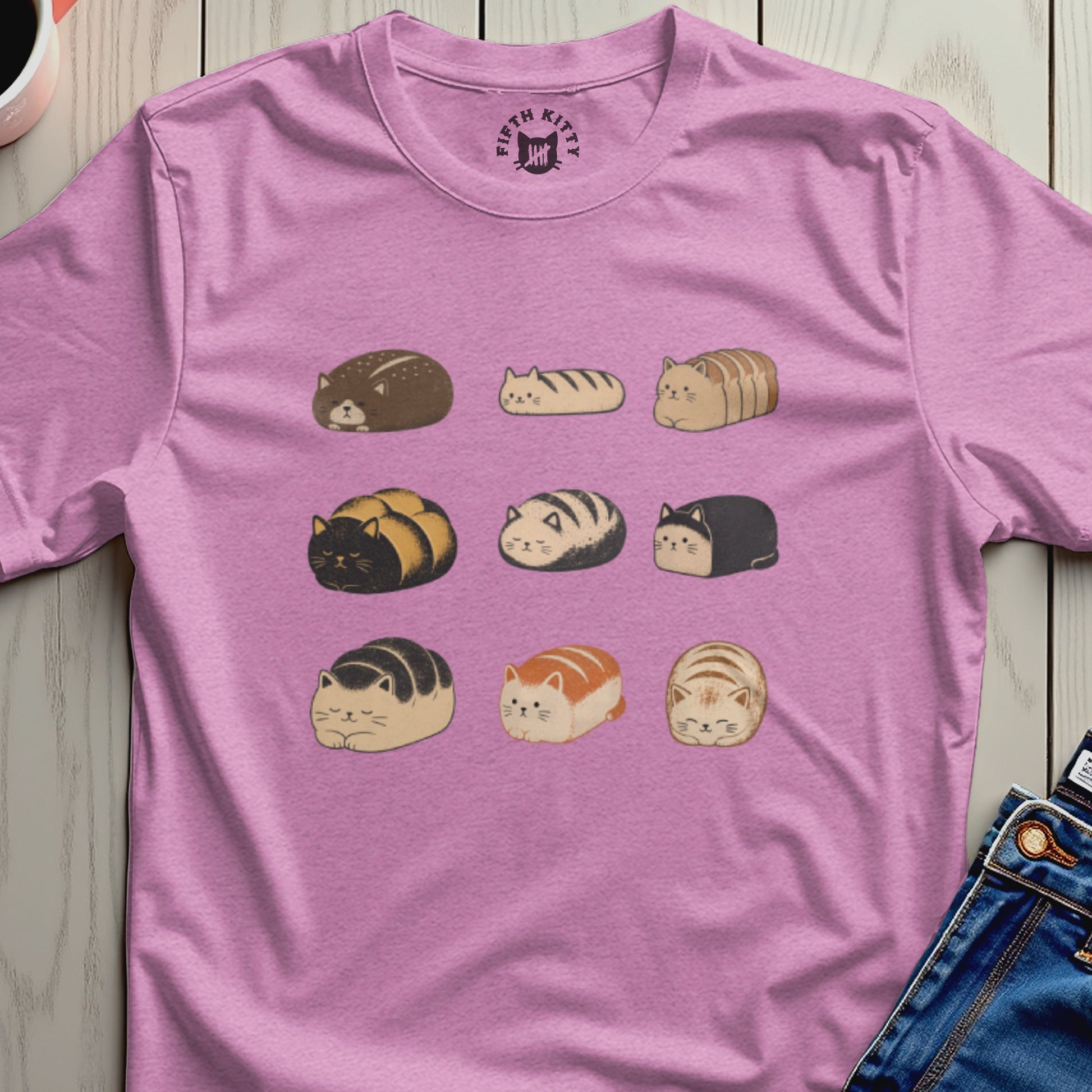 Pink t-shirt with a repeating pattern of nine different loaf-shaped cats.