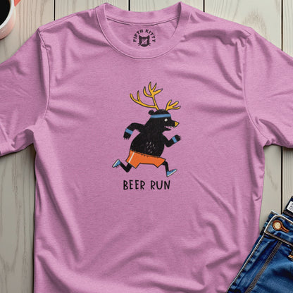 Pink t-shirt with cartoon bear running with antlers, text "BEER RUN" below.