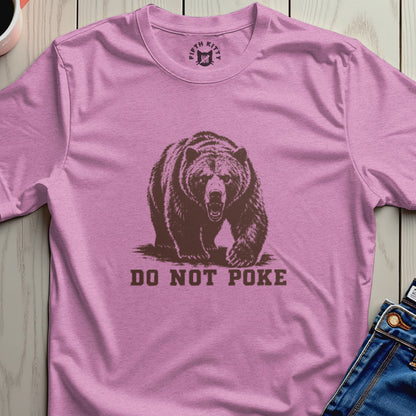 Pink t-shirt with a graphic of a bear and the text "DO NOT POKE".