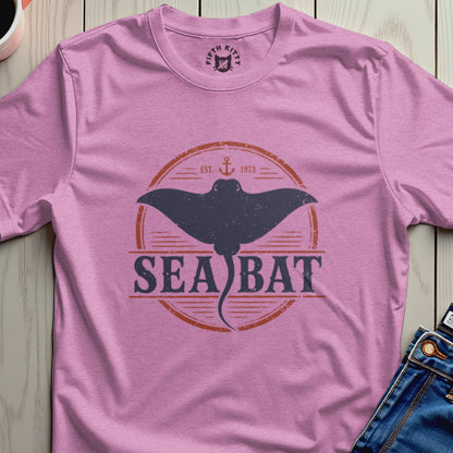 Pink t-shirt with a dark grey sea bat graphic and "SEA BAT EST. 1973" text.