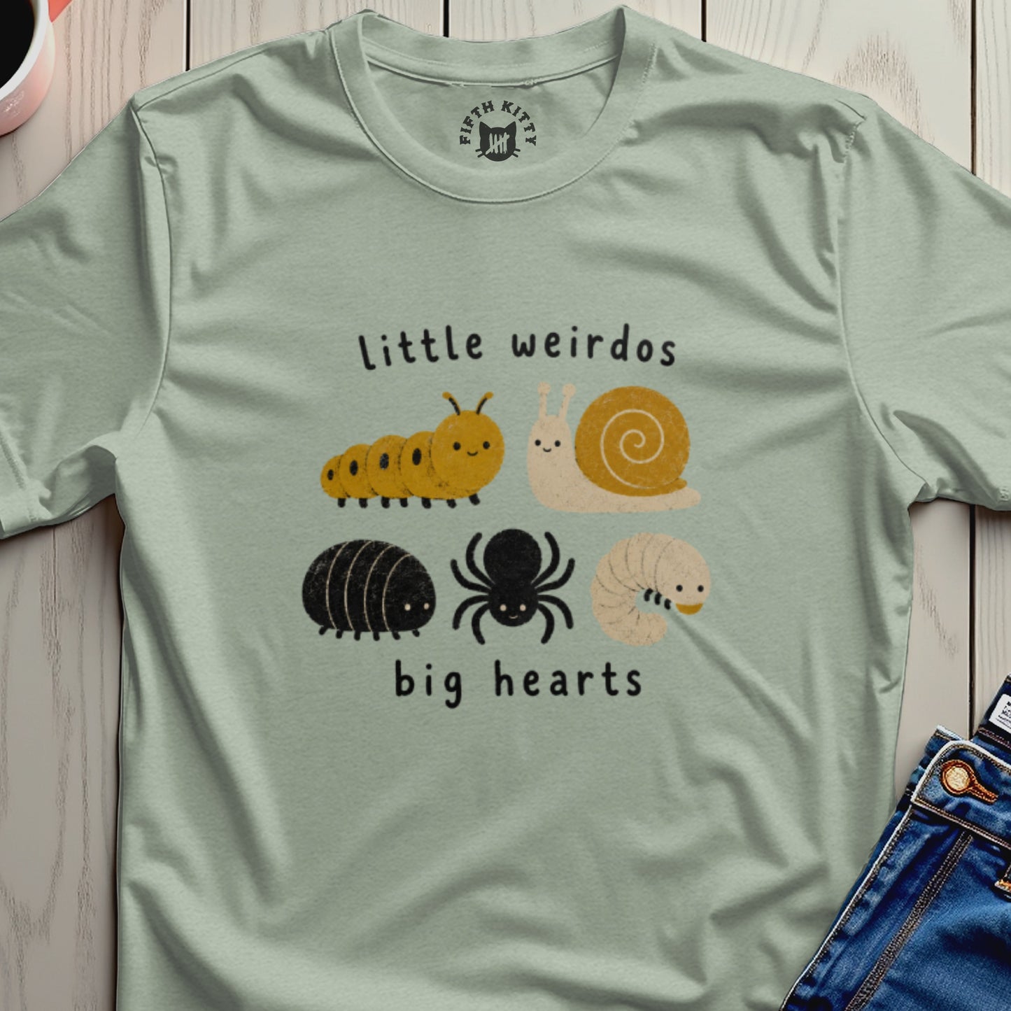 T-shirt with "Little weirdos big hearts" text and cute illustrations of insects.