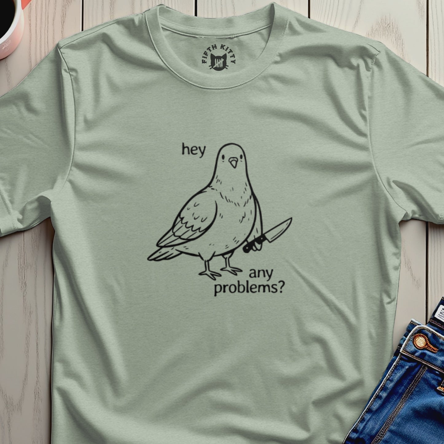Pigeon with a knife and the text "hey any problems?" on a t-shirt.