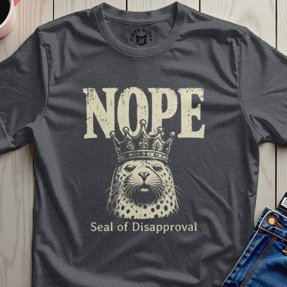 Dark gray t-shirt with distressed graphic of a seal wearing a crown, text reads "Nope Seal of Disapproval".