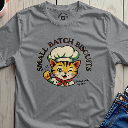 Gray t-shirt with cartoon cat chef wearing a chef hat and bib, saying "Small Batch Biscuits" and "baked with big love."