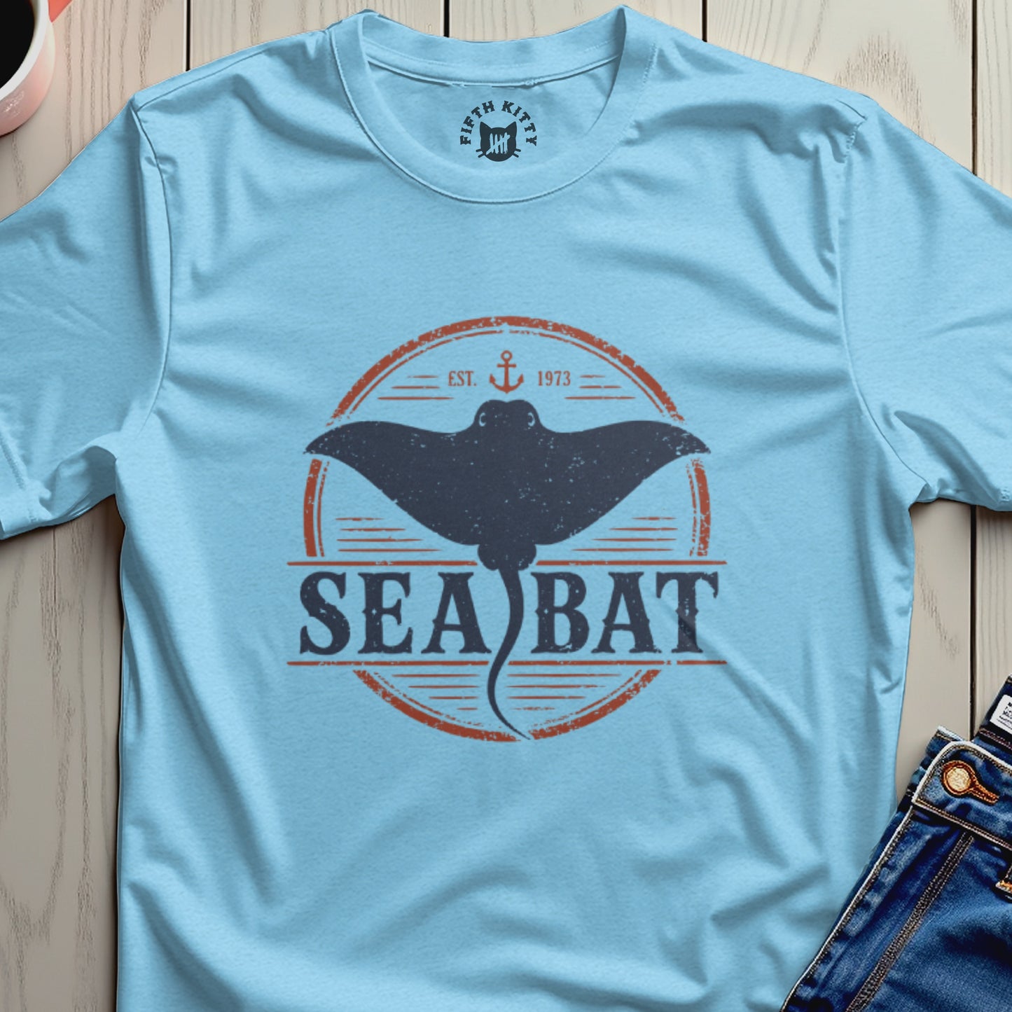 Light blue t-shirt with distressed "Sea Bat" graphic featuring a manta ray.