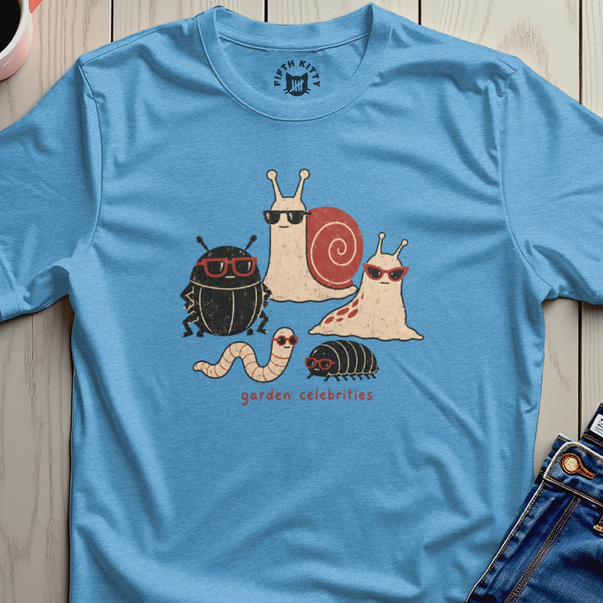 Blue t-shirt with cartoon snails, beetle, worm, and roly-poly wearing sunglasses.