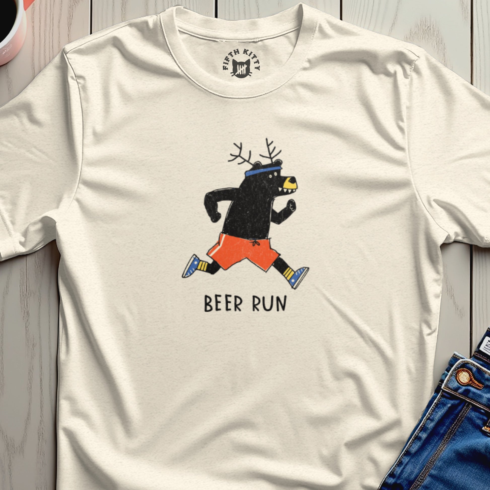 Cream t-shirt with graphic of a running bear with antlers and text "BEER RUN."
