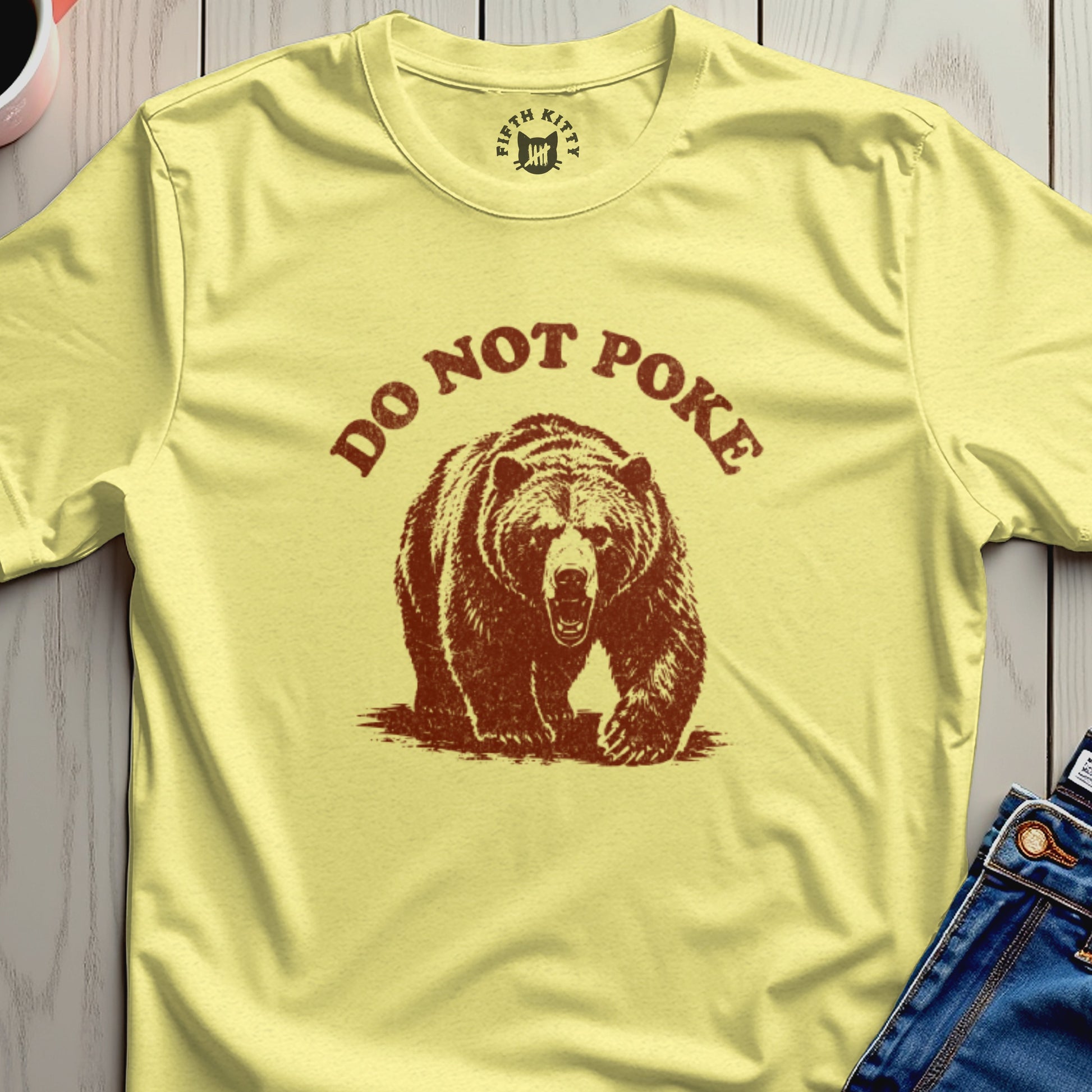 T-shirt with a brown bear graphic and "DO NOT POKE" text.