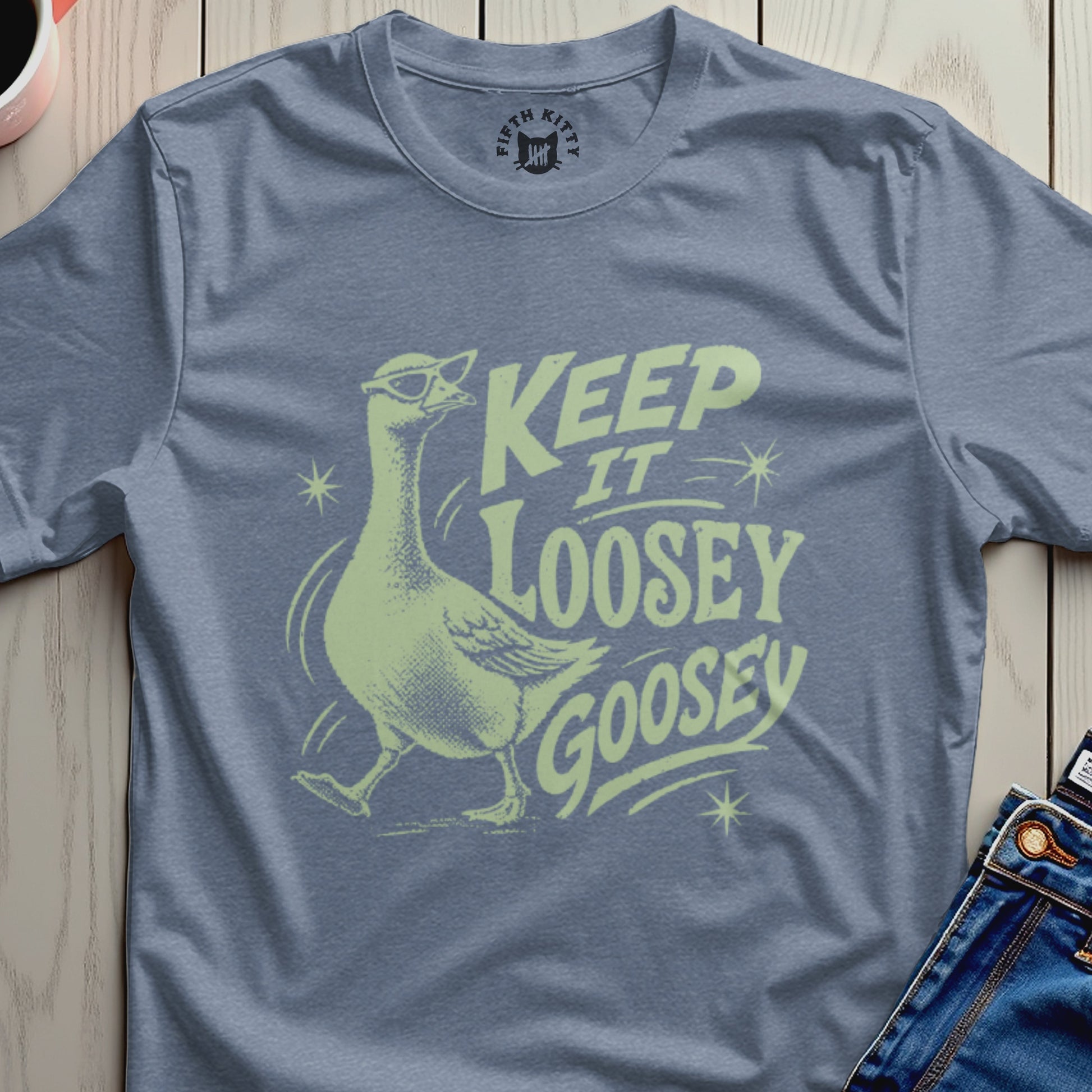 Light blue t-shirt with a goose wearing sunglasses and "KEEP IT LOOSEY GOOSEY" text.