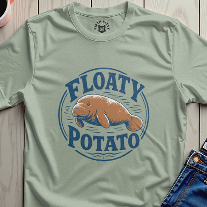 T-shirt with a blue circle graphic featuring a manatee and text "FLOATY POTATO".