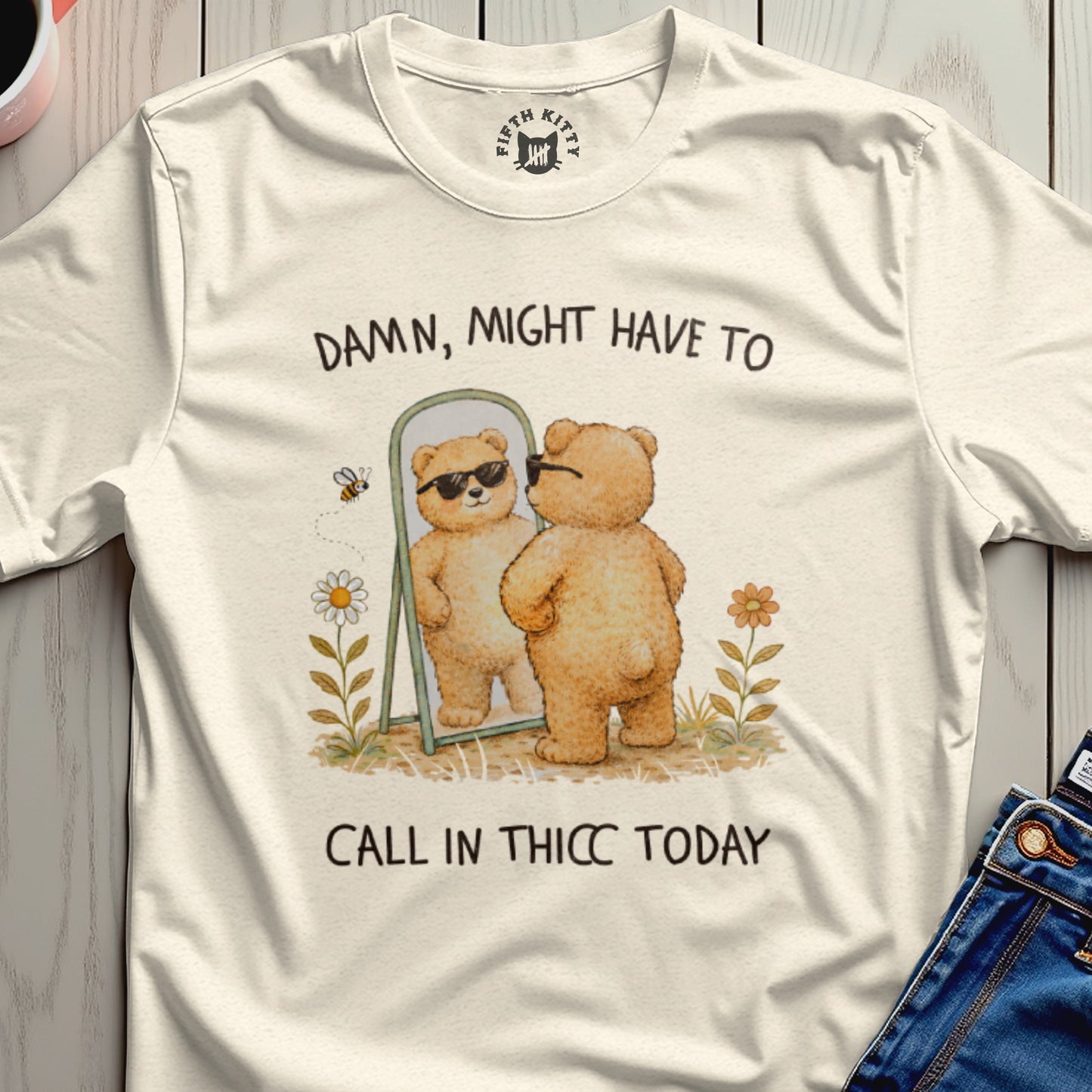 Cream t-shirt with cartoon bear reflecting in mirror, text reads "Damn, might have to call in thicc today".