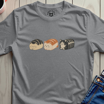 Three loaf-shaped cats wearing striped patterns on the chest of a grey t-shirt.