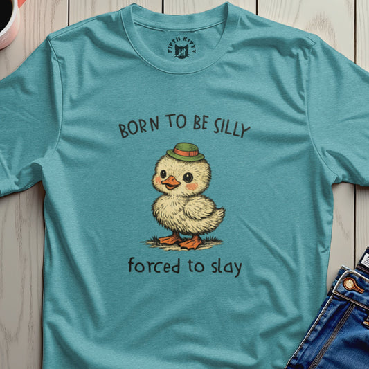 Duckling wearing hat, with text "BORN TO BE SILLY FORCED TO SLAY".