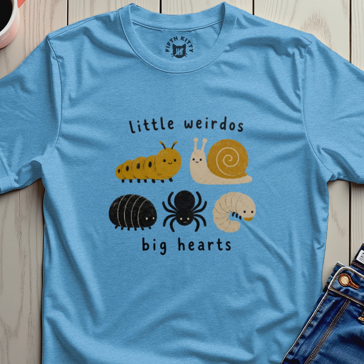 Light blue t-shirt with cute caterpillar, snail, pill bug, spider, and grub on it.