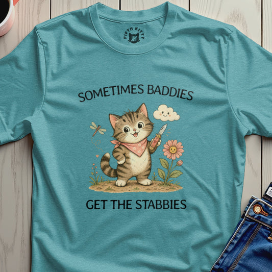 Teal t-shirt with cartoon cat holding a knife and text "Sometimes Baddies Get the Stabbies."