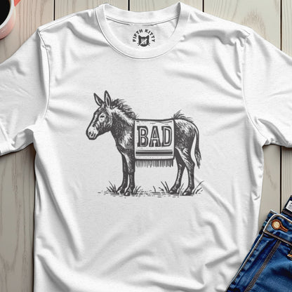 White t-shirt with sketch of a donkey wearing a blanket that says "BAD".