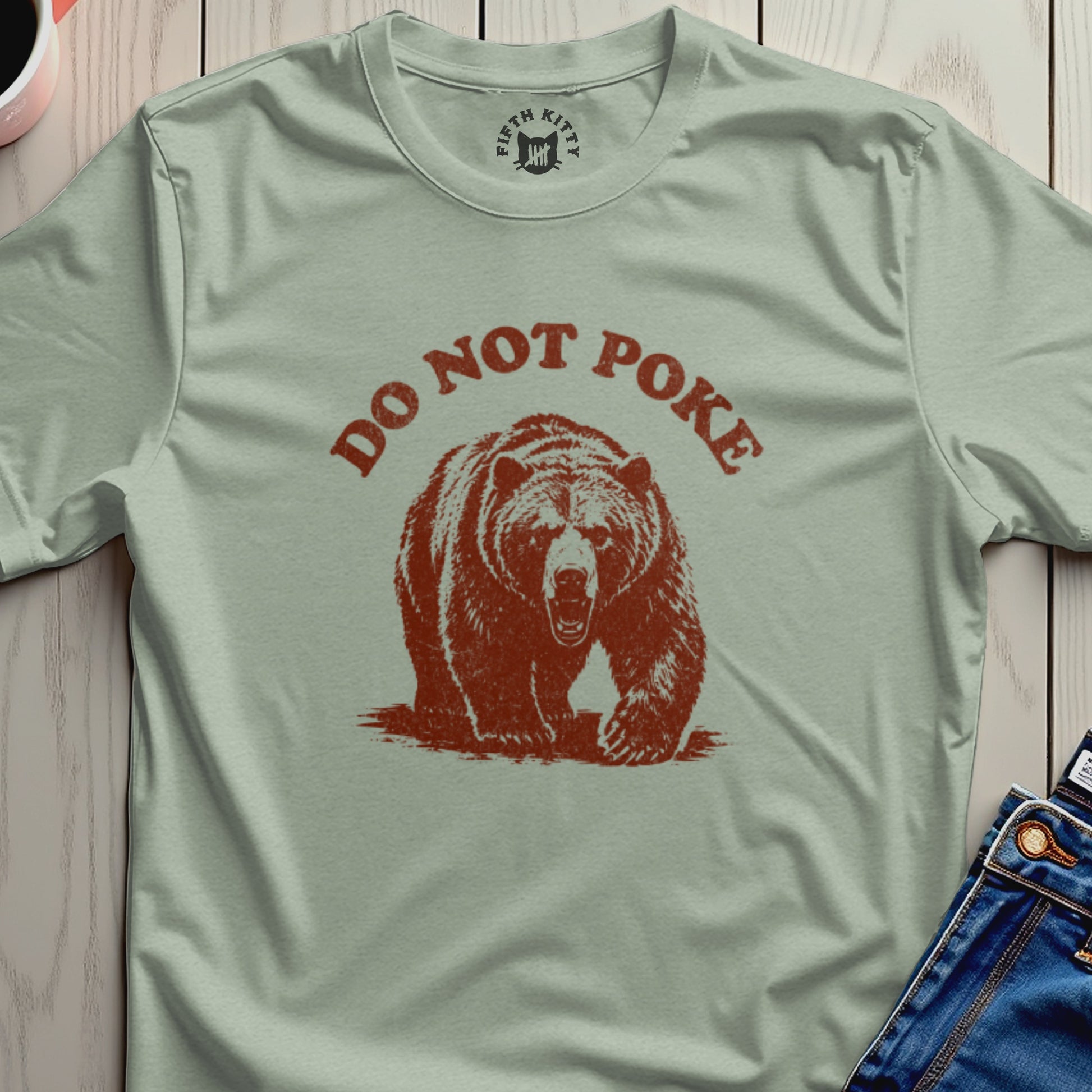 T-shirt with distressed bear graphic and "DO NOT POKE" text.