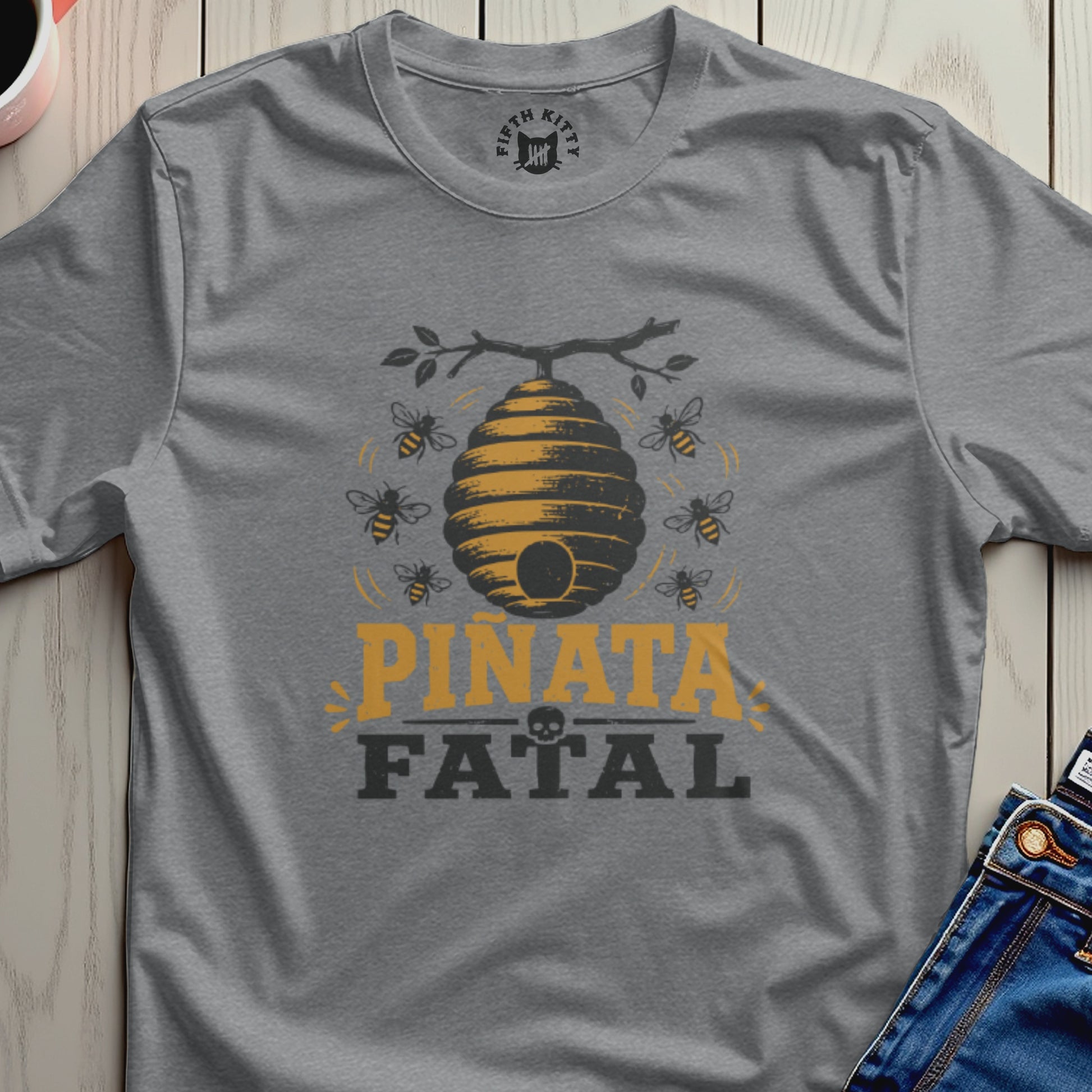 Grey t-shirt with a beehive, bees, and the text "PIÑATA FATAL".