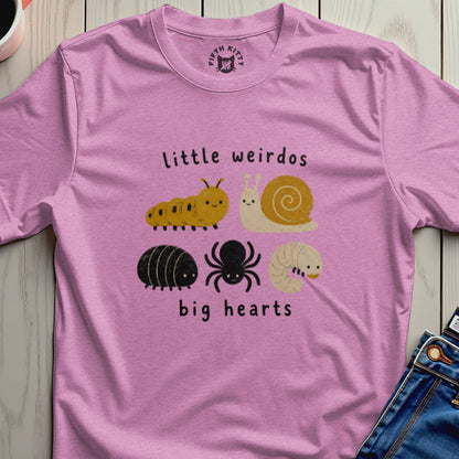 Pink t-shirt with cute caterpillar, snail, bug, spider, and larva illustrations and text.