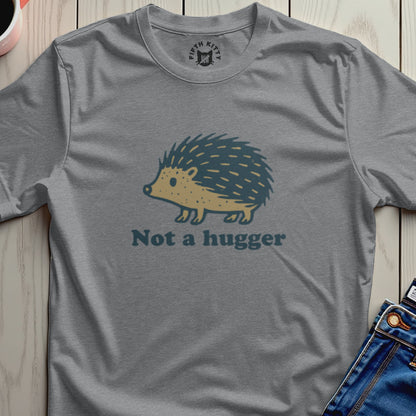 Gray t-shirt with a cartoon hedgehog graphic and "Not a hugger" text.