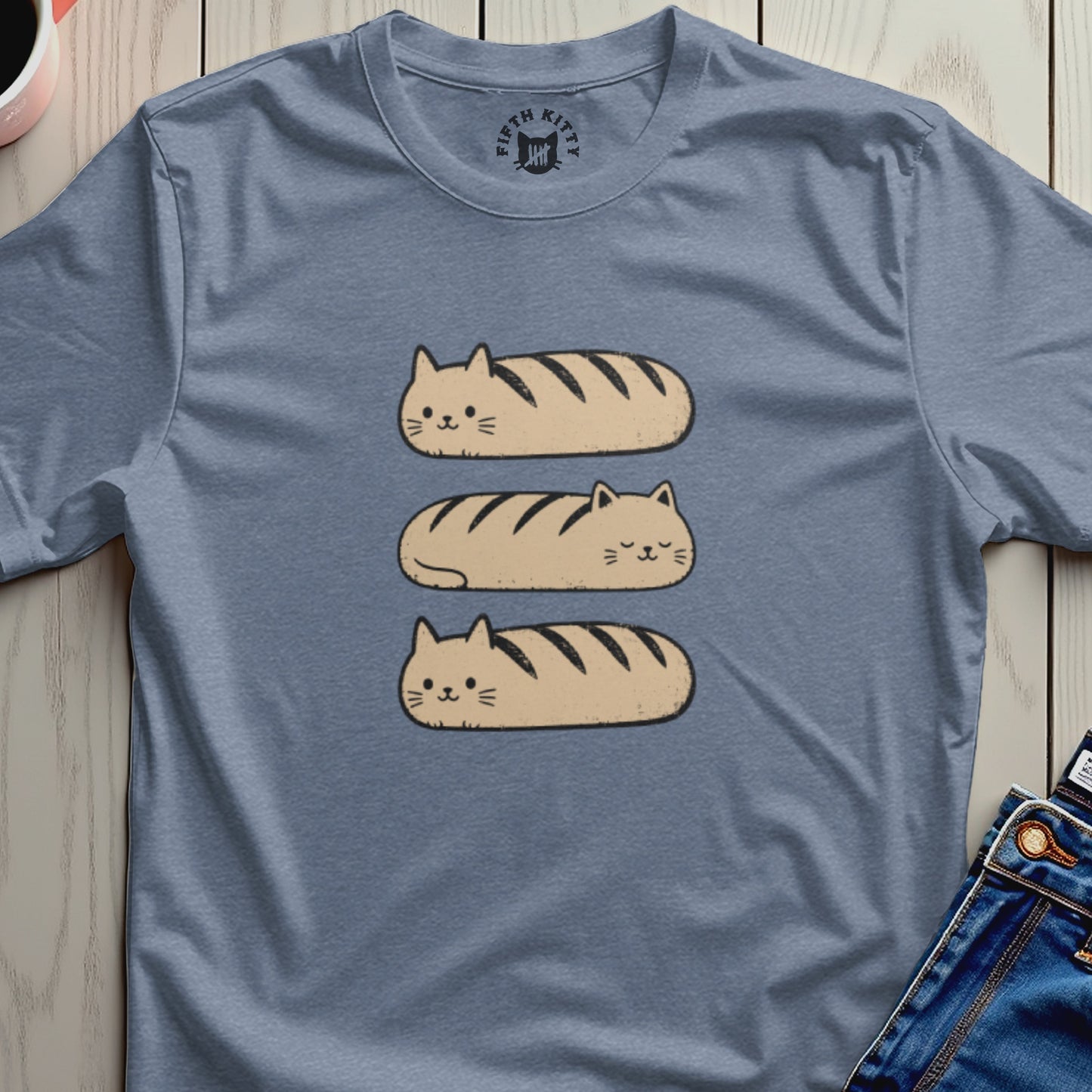 Blue t-shirt with three tan loaf-shaped cats and a Fifth Kitty logo.