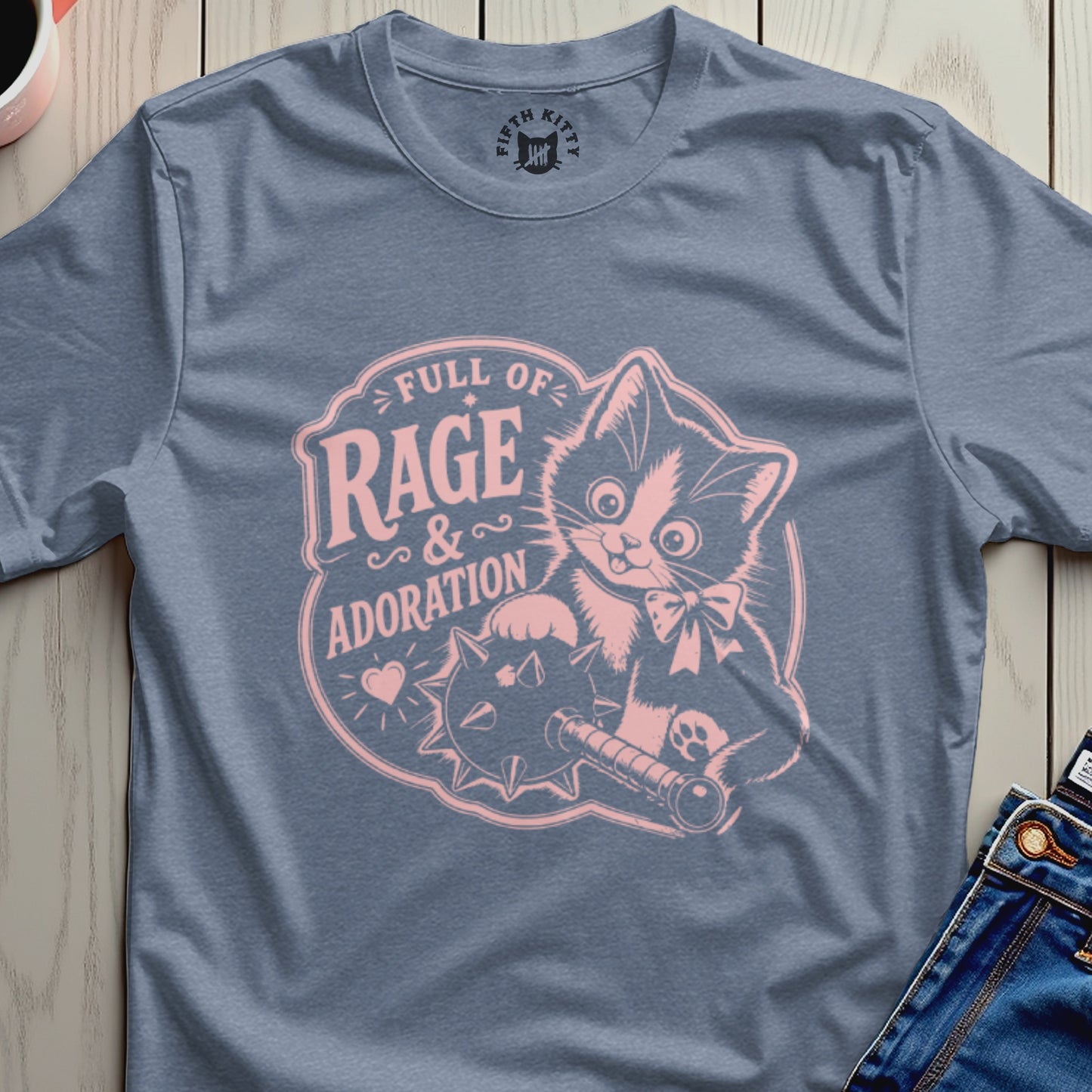 Blue t-shirt with pink graphic of a cat holding a mace, text "Full of Rage & Adoration".