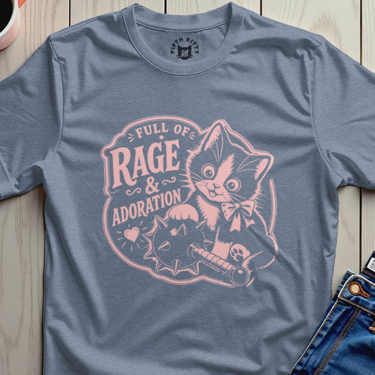 Blue t-shirt with pink graphic of a cat holding a mace, text "Full of Rage & Adoration".
