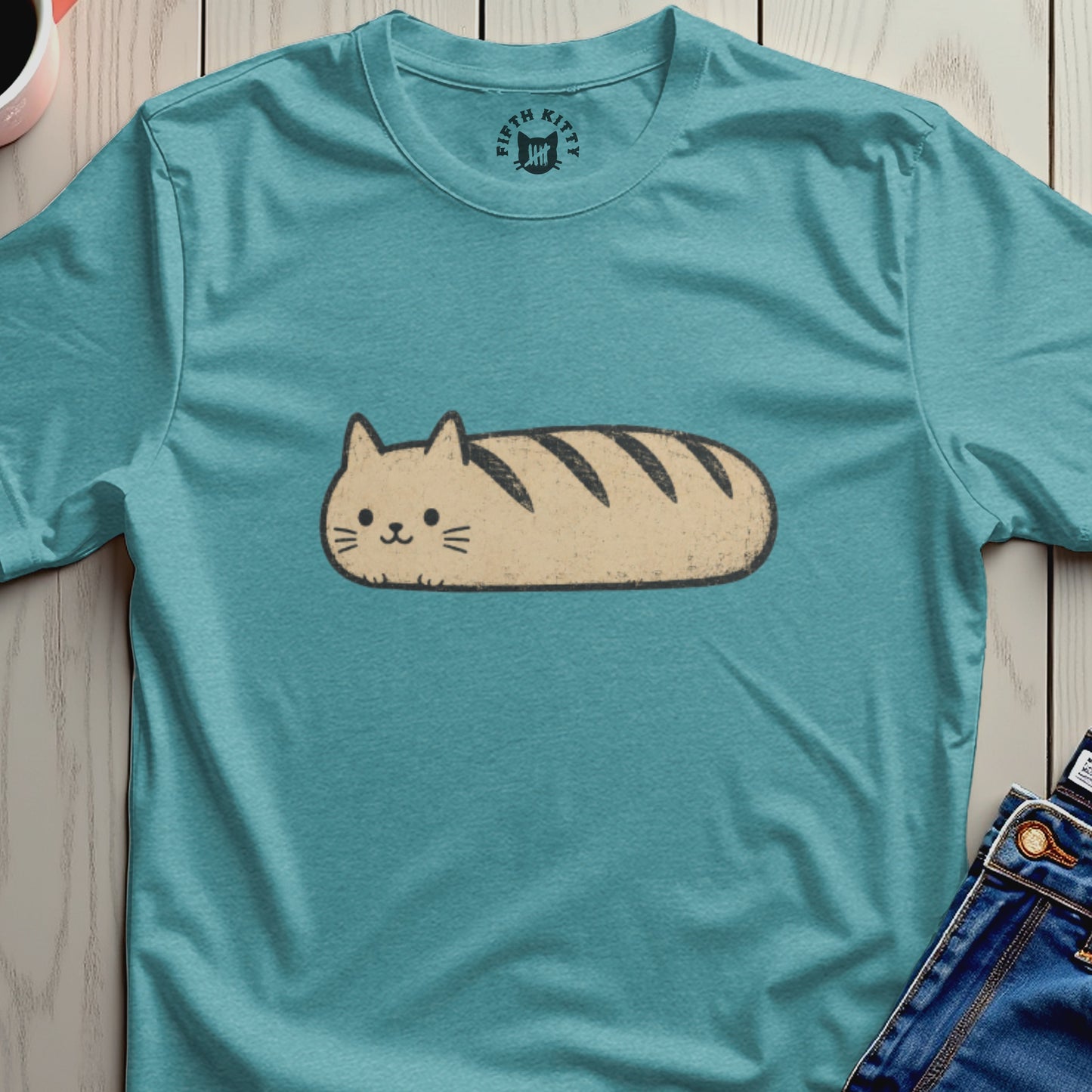 Cat loaf graphic tee with "Fifth Kitty" logo on collar.