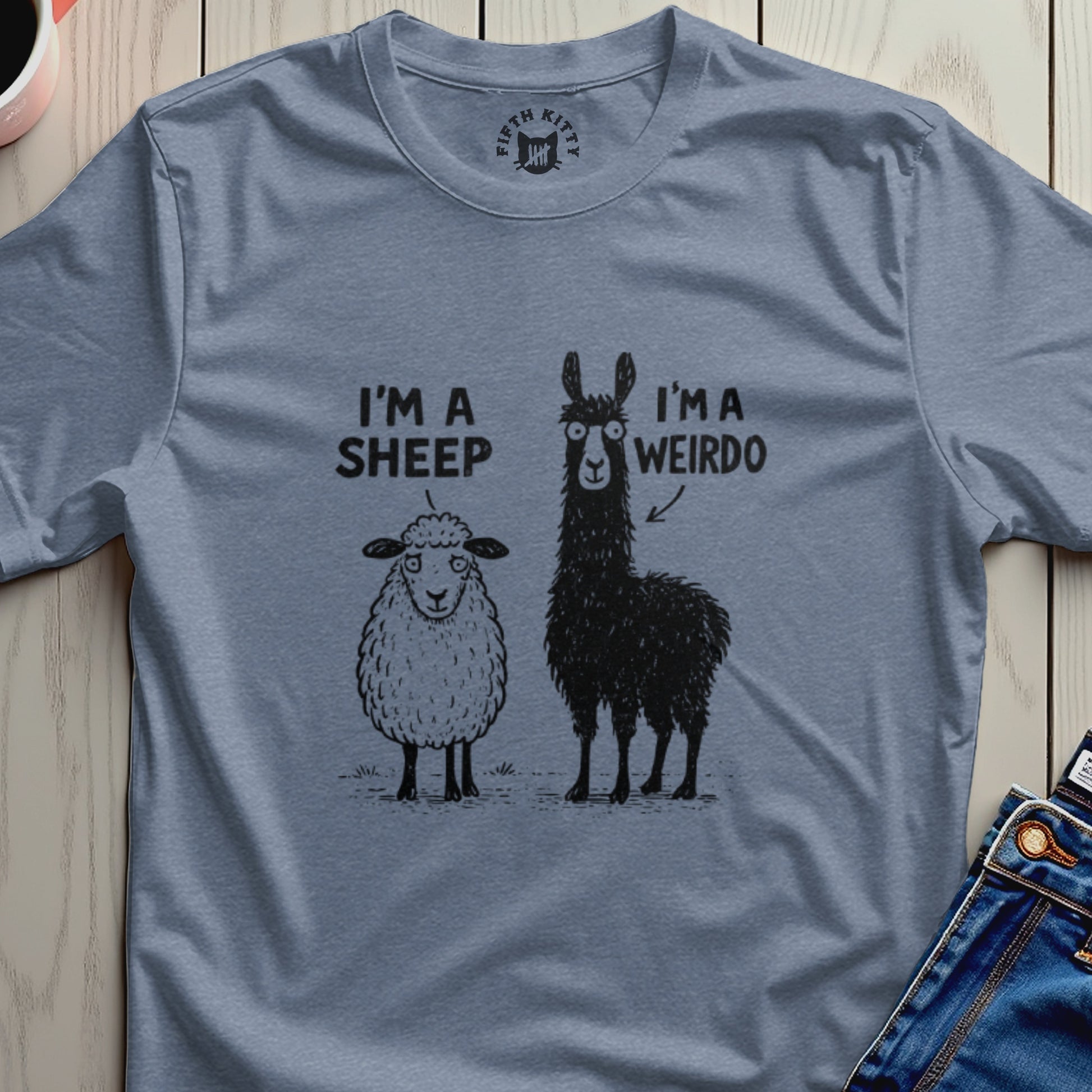 I'm a sheep, I'm a weirdo graphic on a blue t-shirt.