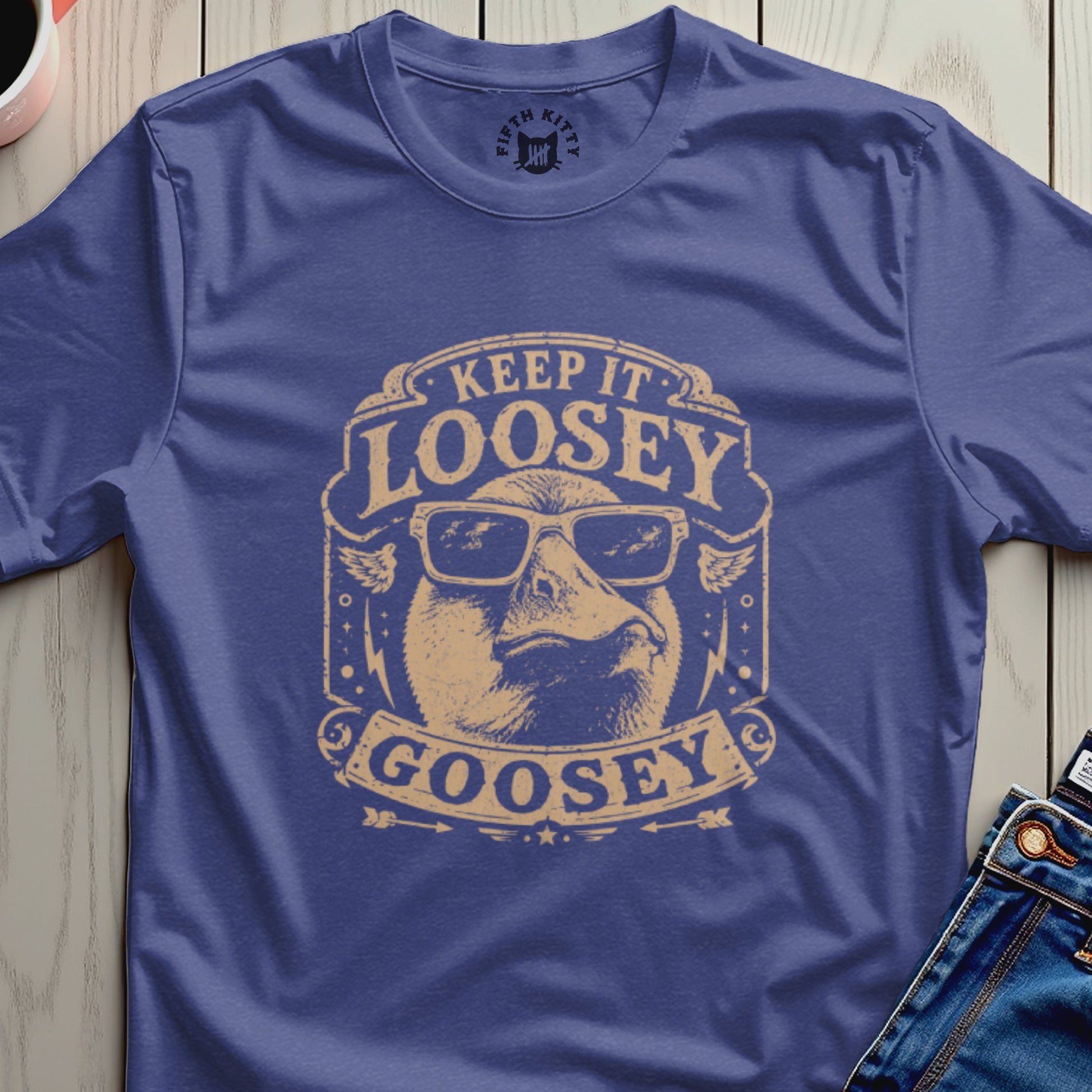 Purple t-shirt with a goose wearing sunglasses and text "KEEP IT LOOSEY GOOSEY".