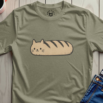 Cute cat loaf graphic on a light green t-shirt.