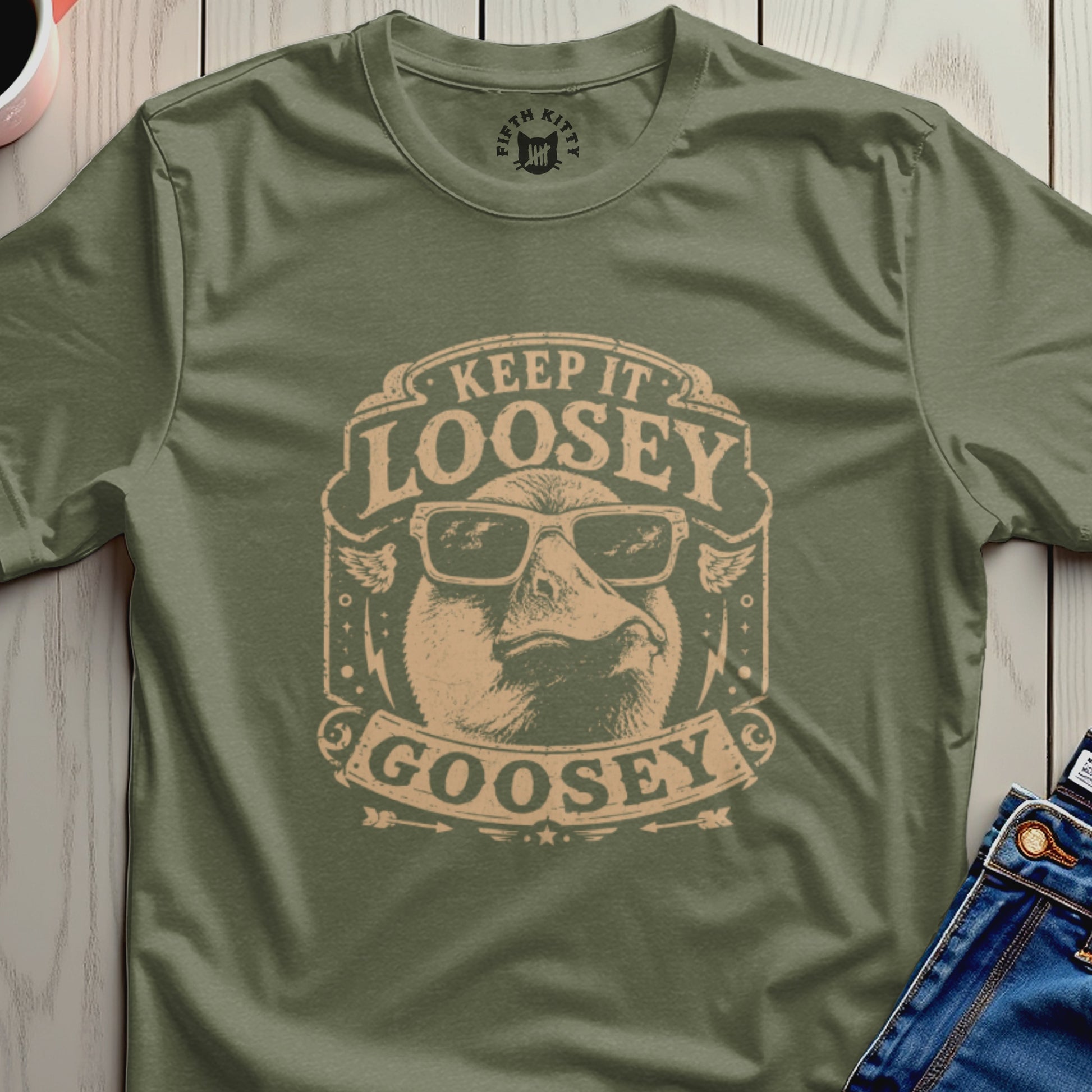 Green t-shirt with "Keep It Loosely Goosey" text and duck sunglasses graphic.