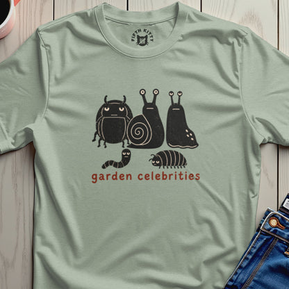 T-shirt with cartoon bugs and snails and "garden celebrities" text.